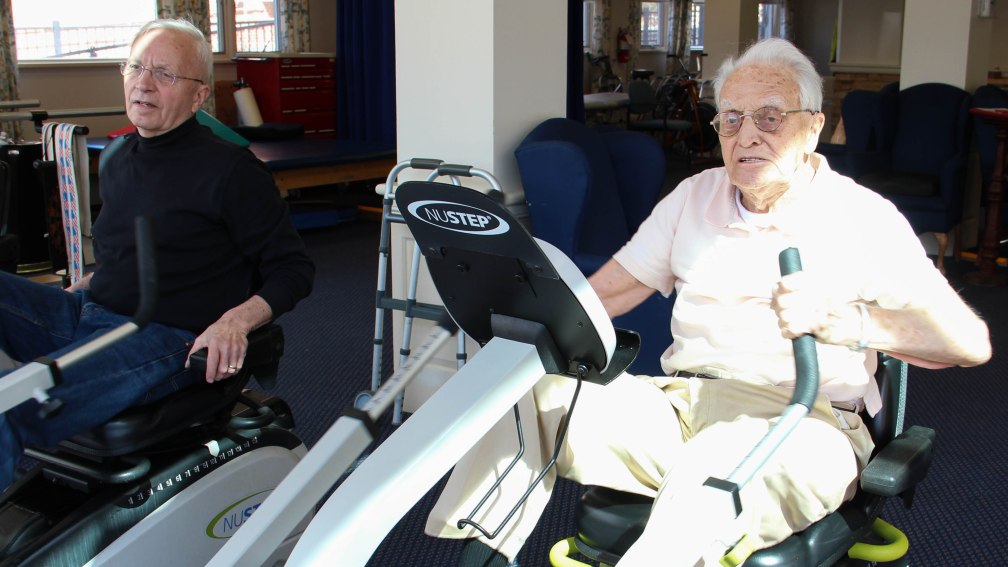 Floyd and David exercising together in the Sherrill House physical therapy gym.